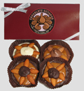 Large Almond Octopus Snappers | 4 Piece Box - The original Chocolate Octopus and our version of the "Turtle."  This assortment contains four large pecan Snappers in milk, dark or white chocolate.  All Snappers are made with our very fresh caramel.  The four large Snappers are packed in a gift box with decorative cord.
